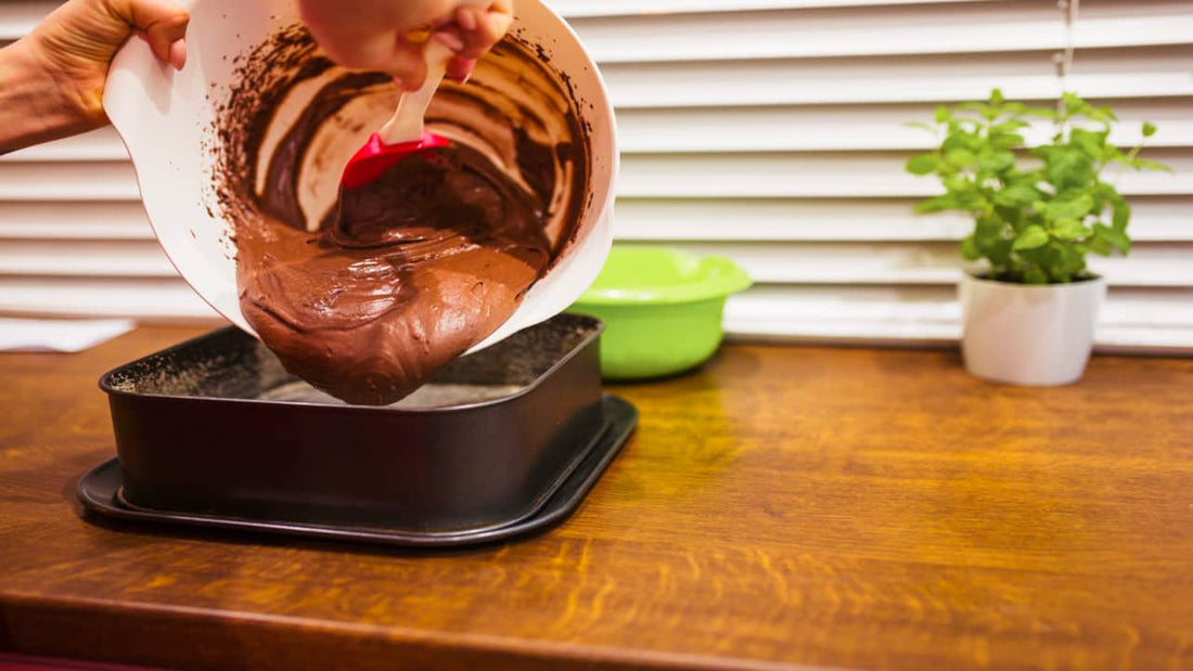 Pouring pastry batter into the pan for baking